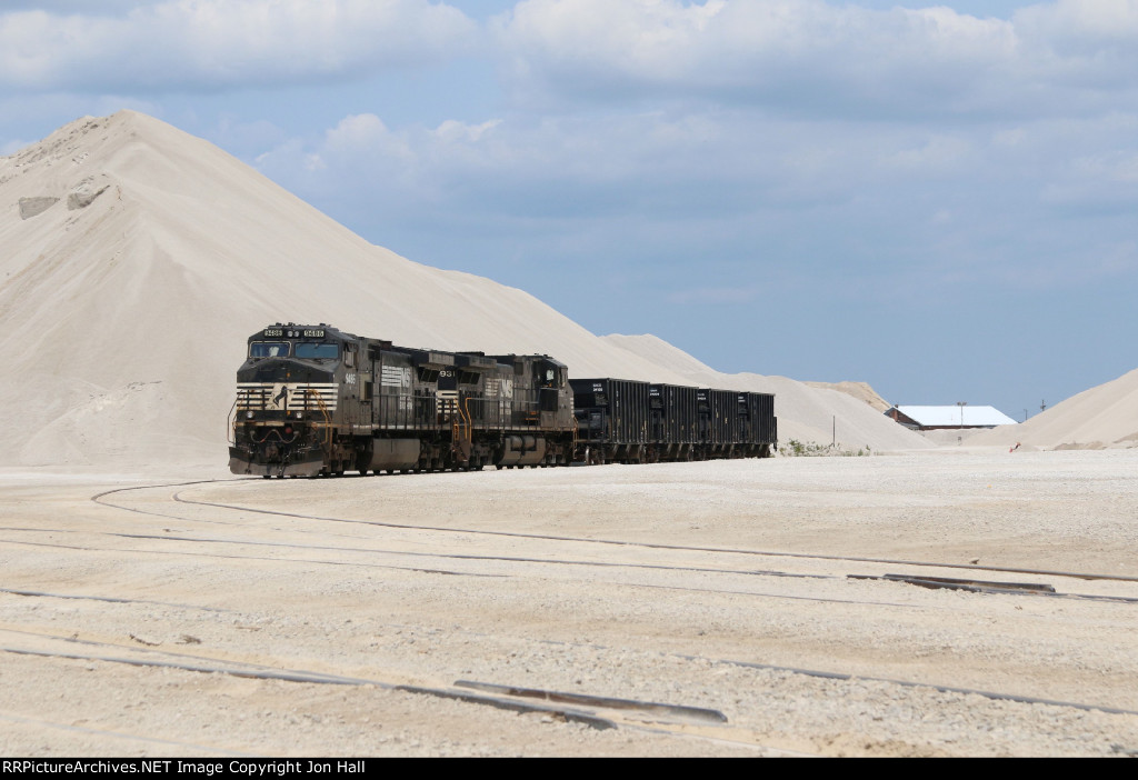 A pair of NS Dash-9's wait under the piles of stone at White Rock Quarry